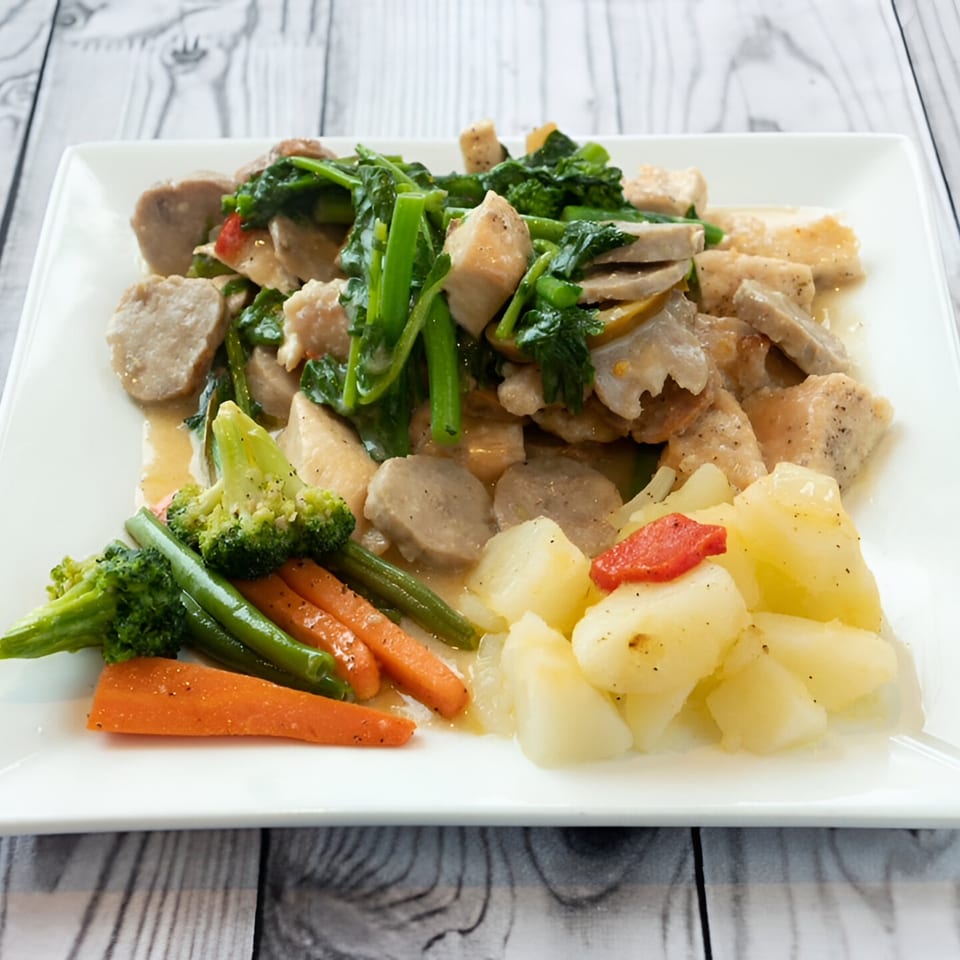 Pavesi Restaurant's Italian dish with chicken, broccoli rabe, potatoes, carrots, and green beans.
